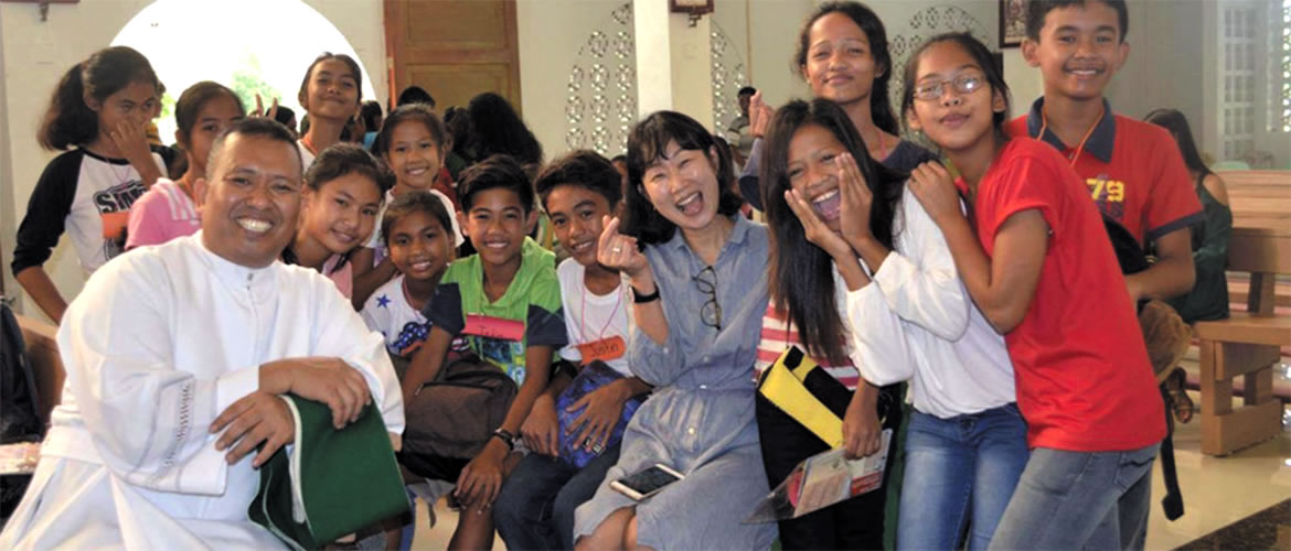 Fr. Rolly in Taiwan with students