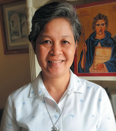 Sr. Anne Carbon, Congregational Leader of the Columban Sisters, with an icon of St. Columban in the background