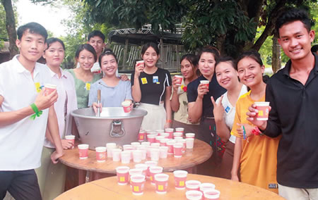 Young people gather around the punch bowl