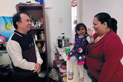 Fr. Dylan visiting with Angela and Alhai