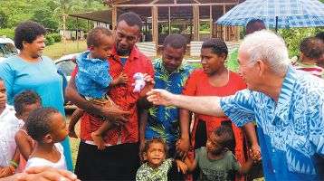 Columban Fr. Frank Hoare playing Santa Claus