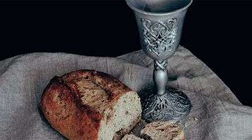 Bread and wine signifying the Body and Blood of Christ