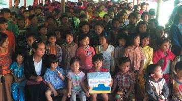 School children gather to say thank you