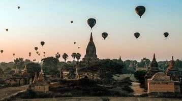 Hot air balloons fly over an ancient city in Myanmar