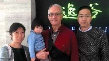 Fr. Warren Kinne with Vincent, his wife and daughter