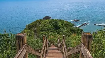 Stairs walking down a hill to the water