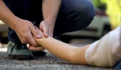 Good Samaritan helping an injured person