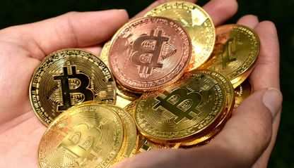 hands full of gold coins