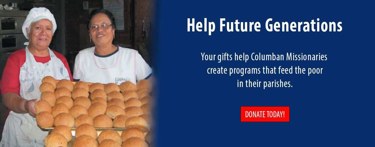 Two bakers displaying trays of bread