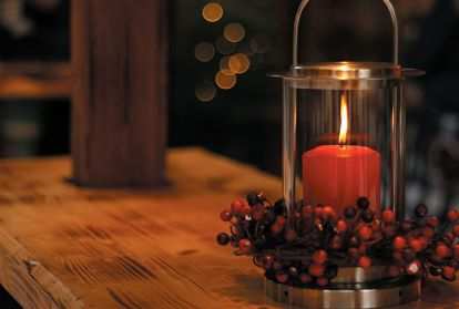 A lighted candle on a table