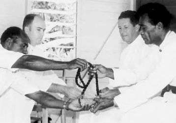 Receiving the whale tooth, the highest Fijian honor