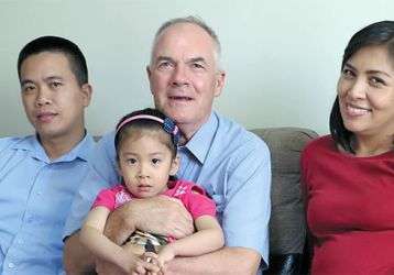 Charito, Fr. John holding Camile and Marisol in Peru