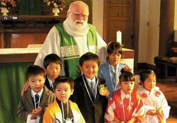 Fr. Barry and young parishioners