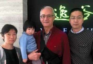 Fr. Warren Kinne with Vincent, his wife and daughter