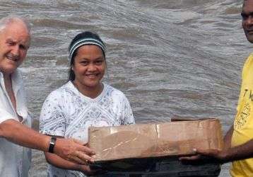 Carrying the altar cloth after the trip across the river